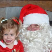 santa with young girl smiling